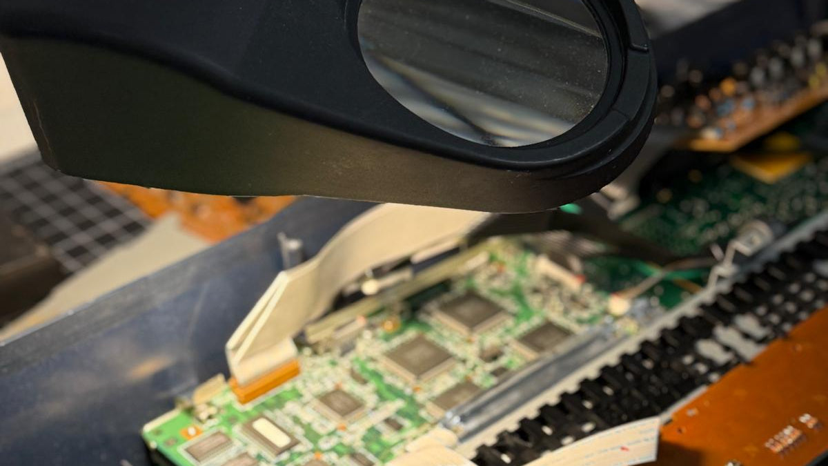 Close-up of a magnifying glass on a blurred background